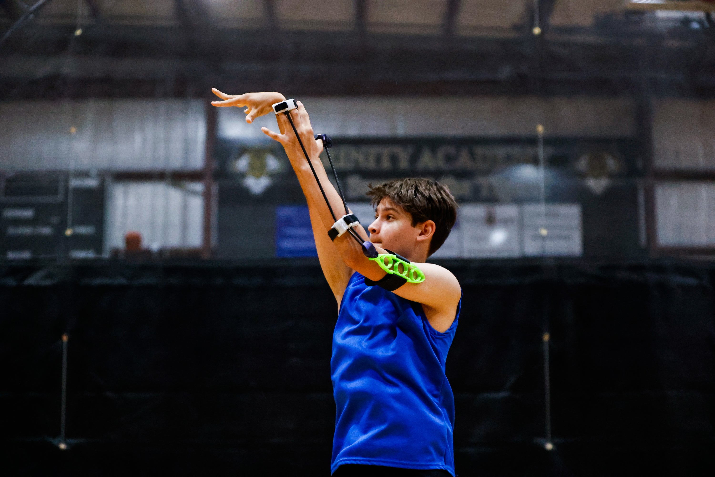 View of young player demonstrating proper shooting form using Perfec'Shot, model CX-30